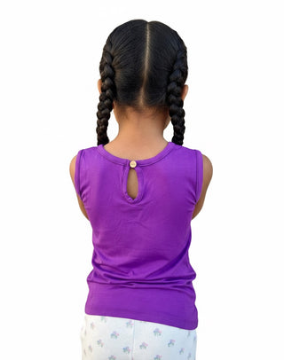 Back view of a child wearing a Twinflower Creations purple bamboo sleeveless tank with a button keyhole detail.